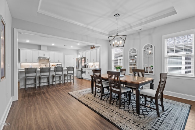 33 Davidson St, Clayton, NC 27527 - dining room with a raised ceiling, dark wood-style flooring, a chandelier, baseboards, and recessed lighting
