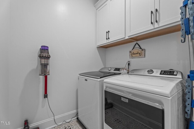 33 Davidson St, Clayton, NC 27527 - laundry room with cabinet space, washer and clothes dryer, and light tile patterned floors