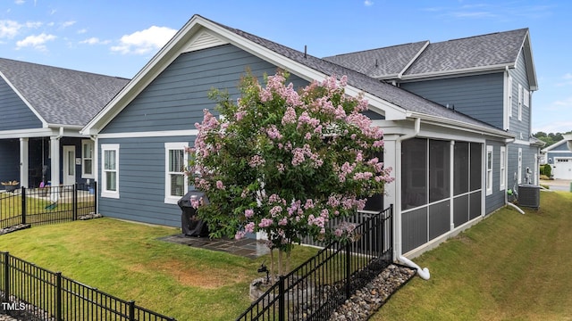 33 Davidson St, Clayton, NC 27527 - view of property exterior featuring a shingled roof and a sunroom