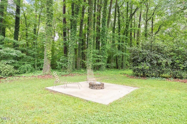1109 Buckingham Rd, Garner, NC 27529 - view of grassy yard with a fire pit and a patio