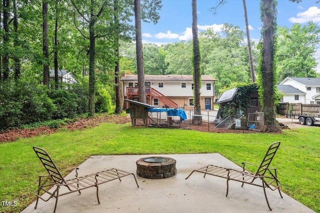 1109 Buckingham Rd, Garner, NC 27529 - view of patio / terrace with an outdoor fire pit and stairway