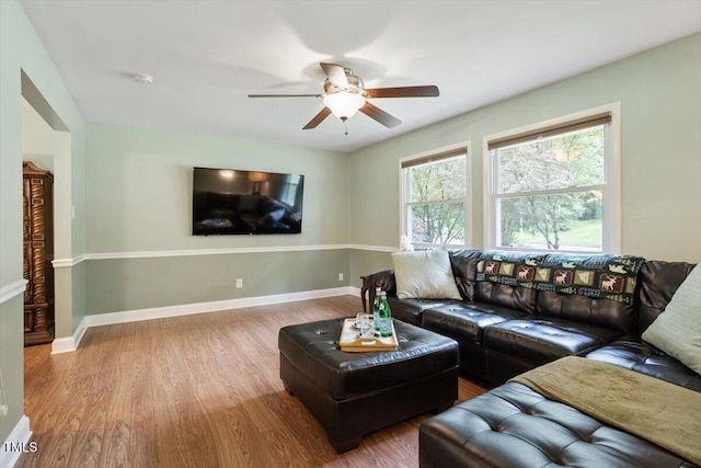 1109 Buckingham Rd, Garner, NC 27529 - living area featuring wood finished floors, a ceiling fan, and baseboards