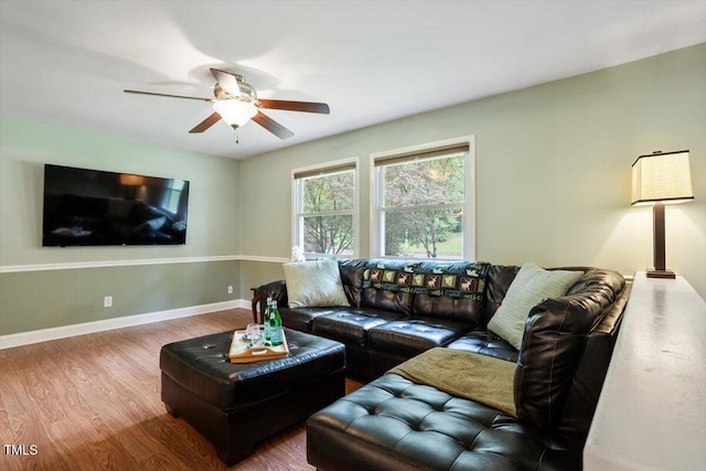 1109 Buckingham Rd, Garner, NC 27529 - living area featuring wood finished floors, a ceiling fan, and baseboards