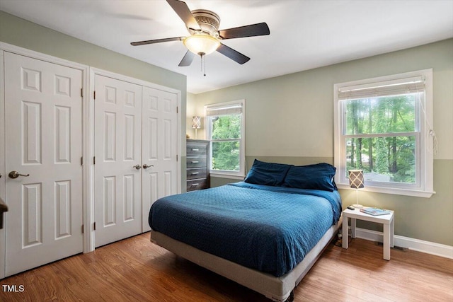 1109 Buckingham Rd, Garner, NC 27529 - bedroom with wood finished floors, ceiling fan, and baseboards