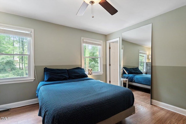 1109 Buckingham Rd, Garner, NC 27529 - bedroom with wood finished floors, baseboards, and a ceiling fan