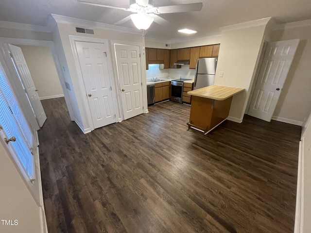 3522 Ivy Commons Dr Unit 101, Raleigh, NC 27606 - kitchen with stainless steel appliances, light countertops, ornamental molding, a peninsula, and baseboards