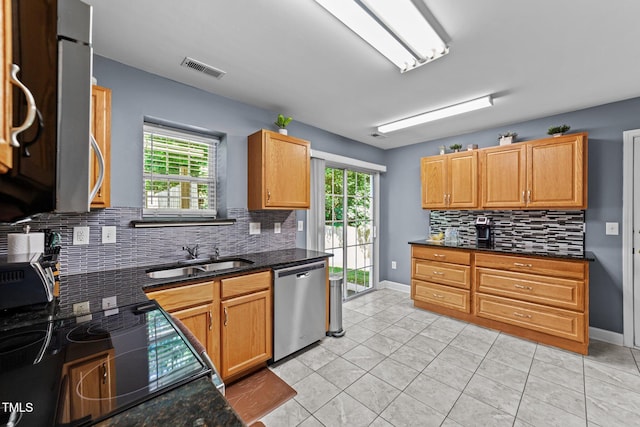 4221 Ivy Hill Rd, Raleigh, NC 27616 - kitchen with stainless steel dishwasher, a sink, backsplash, and plenty of natural light
