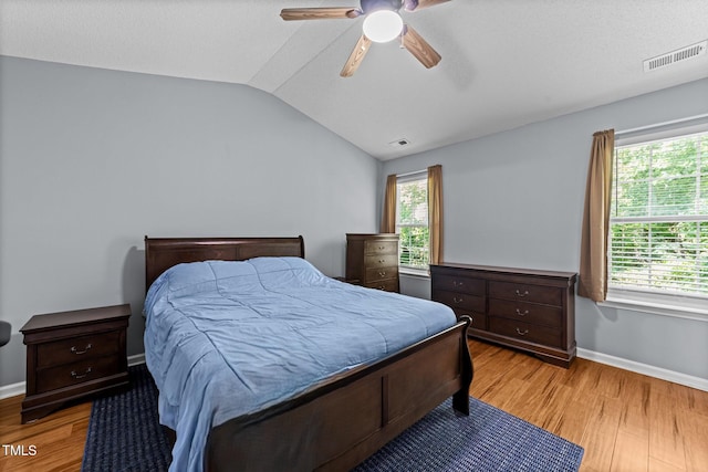 4221 Ivy Hill Rd, Raleigh, NC 27616 - bedroom with light wood-type flooring, vaulted ceiling, baseboards, and a ceiling fan