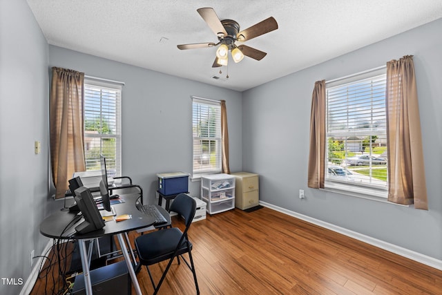 4221 Ivy Hill Rd, Raleigh, NC 27616 - office with wood finished floors, a ceiling fan, baseboards, and a textured ceiling