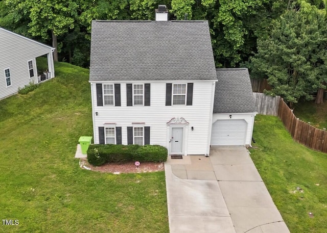 4221 Ivy Hill Rd, Raleigh, NC 27616 - colonial inspired home featuring roof with shingles, a garage, concrete driveway, and a chimney