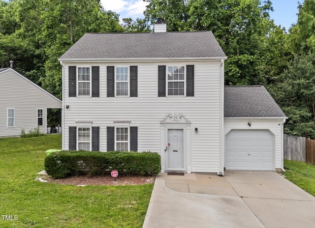 4221 Ivy Hill Rd, Raleigh, NC 27616 - colonial house with concrete driveway, a chimney, an attached garage, and roof with shingles