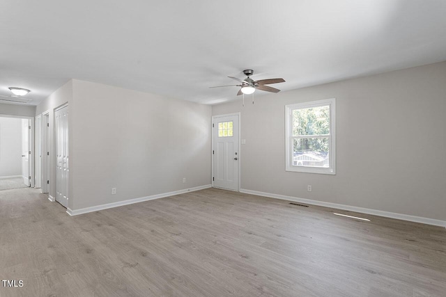 2612 Glenbrook Dr, Durham, NC 27704 - spare room featuring a ceiling fan, light wood-style floors, and baseboards