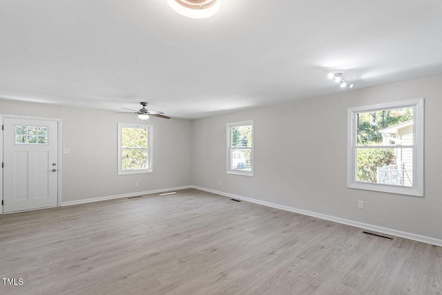 2612 Glenbrook Dr, Durham, NC 27704 - spare room with plenty of natural light, light wood-style floors, ceiling fan, and baseboards