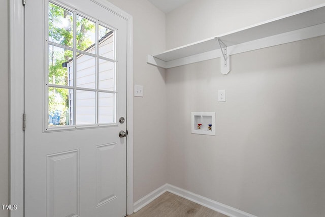 2612 Glenbrook Dr, Durham, NC 27704 - washroom featuring hookup for a washing machine, baseboards, and light wood-type flooring