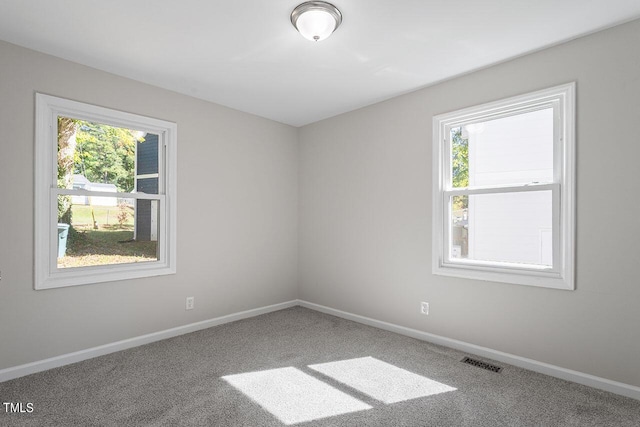 2612 Glenbrook Dr, Durham, NC 27704 - carpeted empty room with baseboards