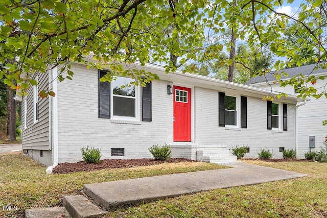 2612 Glenbrook Dr, Durham, NC 27704 - view of front of house featuring crawl space, brick siding, entry steps, and a front yard
