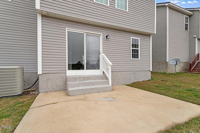 197 Scranton Ct, Cameron, NC 28326 - doorway to property featuring central AC, a patio area, and a lawn