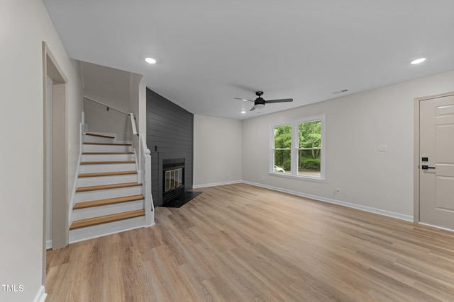 708 Powell Dr Unit B, Raleigh, NC 27606 - unfurnished living room with ceiling fan, light wood-style floors, baseboards, stairway, and recessed lighting