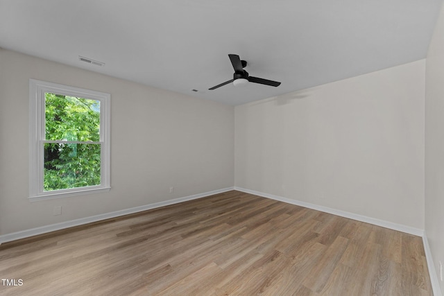 708 Powell Dr Unit B, Raleigh, NC 27606 - empty room with light wood-type flooring, baseboards, and a ceiling fan