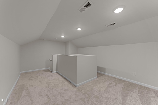 708 Powell Dr Unit B, Raleigh, NC 27606 - additional living space featuring vaulted ceiling, carpet flooring, baseboards, and recessed lighting