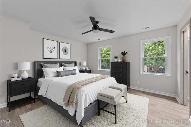 708 Powell Dr Unit B, Raleigh, NC 27606 - bedroom with light wood-type flooring, baseboards, and a ceiling fan