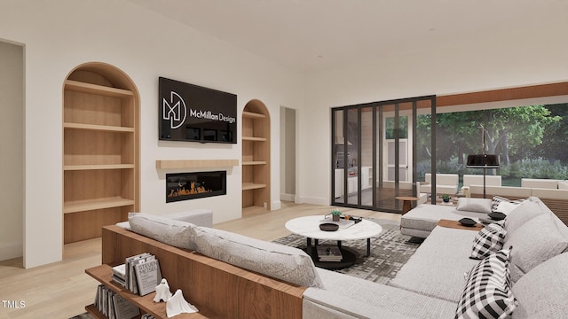 5013 Coronado, Raleigh, NC 27609 - living room featuring built in shelves, wood finished floors, a glass covered fireplace, and baseboards