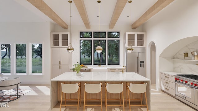 5013 Coronado, Raleigh, NC 27609 - kitchen with high quality appliances, beamed ceiling, light stone countertops, light wood-style floors, and plenty of natural light