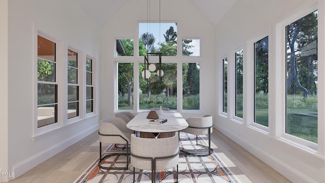 5013 Coronado, Raleigh, NC 27609 - sunroom featuring wood finished floors, baseboards, and high vaulted ceiling