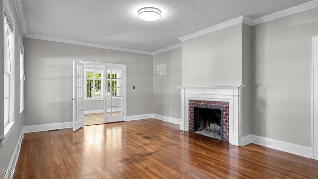 830 S Chestnut St, Henderson, NC 27536 - unfurnished living room with wood finished floors, a fireplace, crown molding, and baseboards