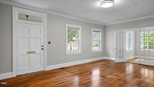 830 S Chestnut St, Henderson, NC 27536 - foyer entrance with wood finished floors, french doors, baseboards, and ornamental molding