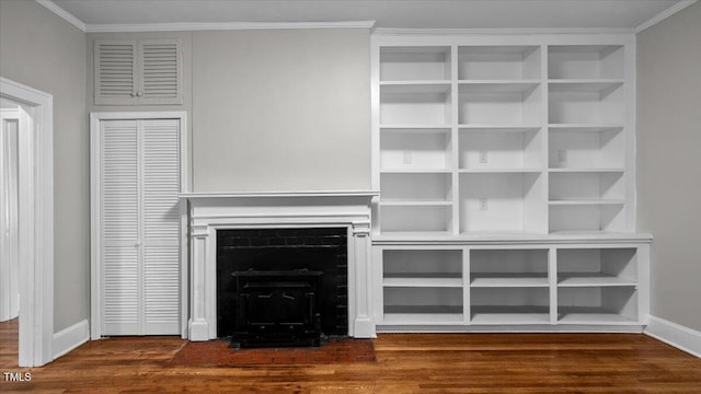 830 S Chestnut St, Henderson, NC 27536 - unfurnished living room with dark wood-style floors, baseboards, ornamental molding, and a fireplace with flush hearth