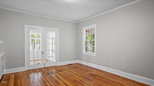 830 S Chestnut St, Henderson, NC 27536 - spare room with hardwood / wood-style floors, baseboards, and crown molding