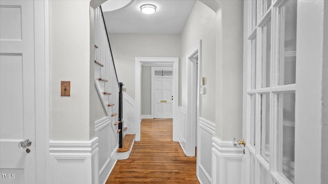 830 S Chestnut St, Henderson, NC 27536 - corridor featuring dark wood-type flooring, stairs, and a decorative wall