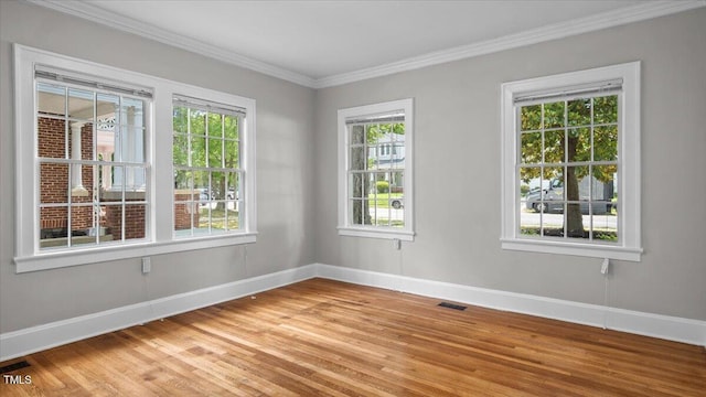 830 S Chestnut St, Henderson, NC 27536 - spare room featuring light wood finished floors, baseboards, and crown molding