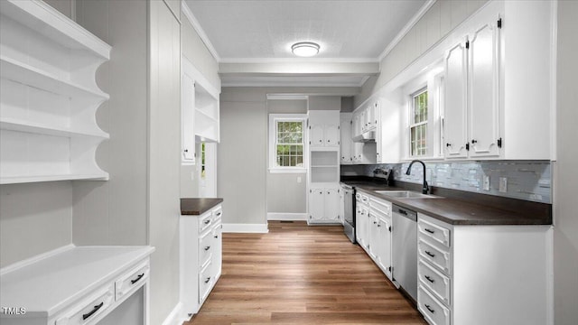 830 S Chestnut St, Henderson, NC 27536 - kitchen with a sink, appliances with stainless steel finishes, open shelves, dark countertops, and crown molding