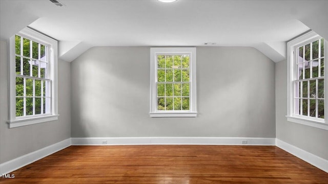 830 S Chestnut St, Henderson, NC 27536 - additional living space featuring baseboards, wood finished floors, and lofted ceiling