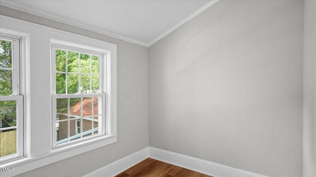 830 S Chestnut St, Henderson, NC 27536 - spare room with crown molding, baseboards, and dark wood-type flooring