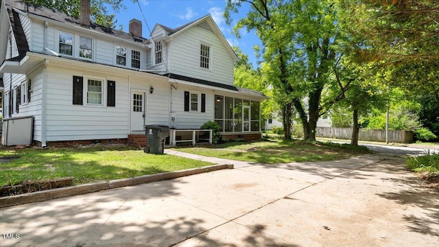 830 S Chestnut St, Henderson, NC 27536 - back of property with a sunroom and a chimney