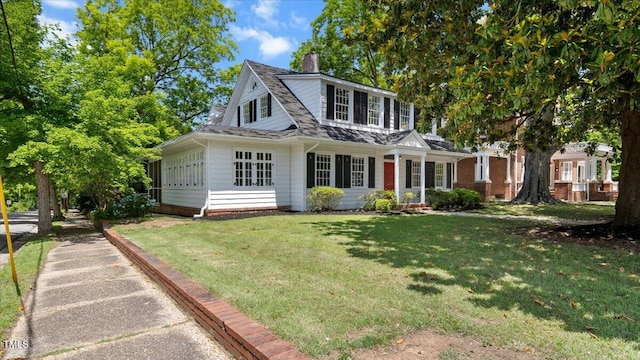 830 S Chestnut St, Henderson, NC 27536 - view of front of home featuring a chimney and a front lawn
