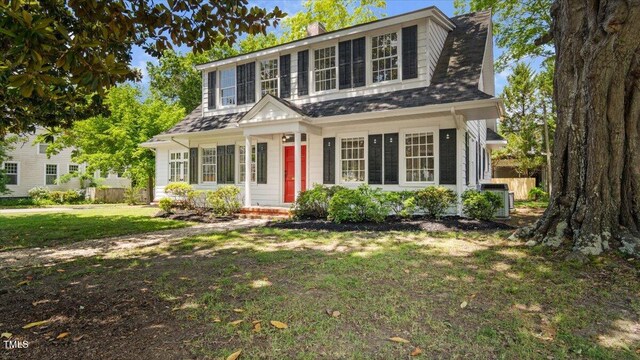 830 S Chestnut St, Henderson, NC 27536 - view of front of house with central air condition unit and a chimney