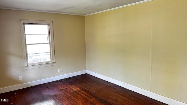 823 Dixon St, Kinston, NC 28501 - unfurnished room featuring dark wood-style flooring, baseboards, and ornamental molding