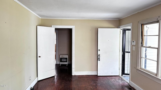 823 Dixon St, Kinston, NC 28501 - entryway with heating unit, baseboards, wood finished floors, and ornamental molding
