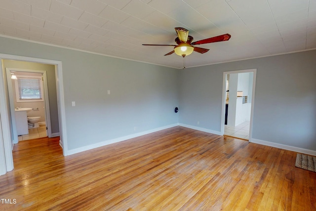 111 Dee Long Rd, Roxboro, NC 27574 - spare room featuring ornamental molding, ceiling fan, light wood finished floors, and baseboards