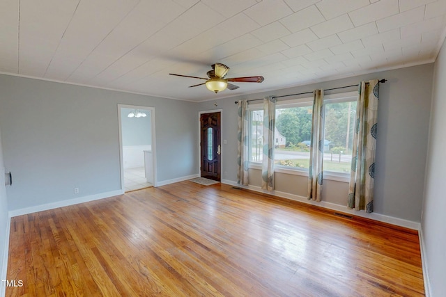 111 Dee Long Rd, Roxboro, NC 27574 - unfurnished room with light wood-style floors, ceiling fan, crown molding, and baseboards