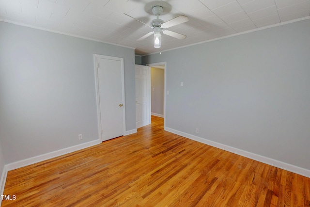 111 Dee Long Rd, Roxboro, NC 27574 - empty room featuring crown molding, light wood finished floors, a ceiling fan, and baseboards