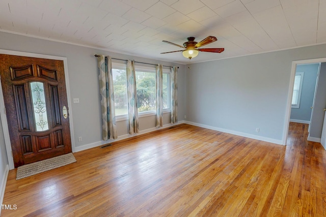 111 Dee Long Rd, Roxboro, NC 27574 - entrance foyer with healthy amount of natural light, crown molding, light wood finished floors, and ceiling fan