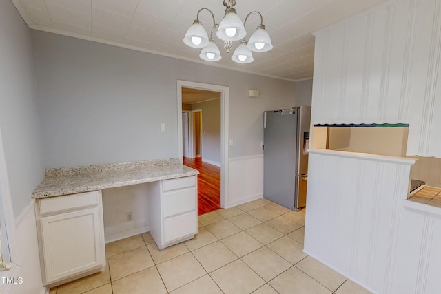 111 Dee Long Rd, Roxboro, NC 27574 - kitchen with freestanding refrigerator, a chandelier, light tile patterned flooring, pendant lighting, and ornamental molding