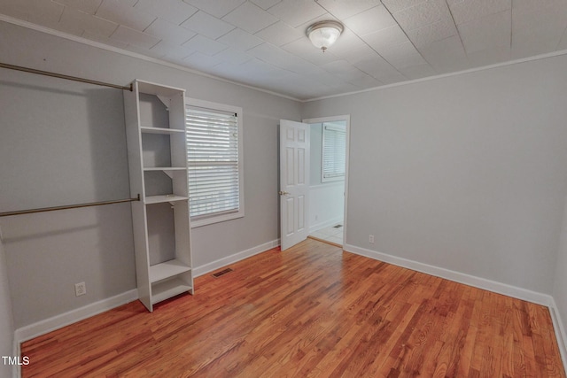111 Dee Long Rd, Roxboro, NC 27574 - unfurnished bedroom with crown molding, wood finished floors, and baseboards