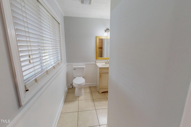 111 Dee Long Rd, Roxboro, NC 27574 - half bathroom with vanity, toilet, tile patterned flooring, and baseboards