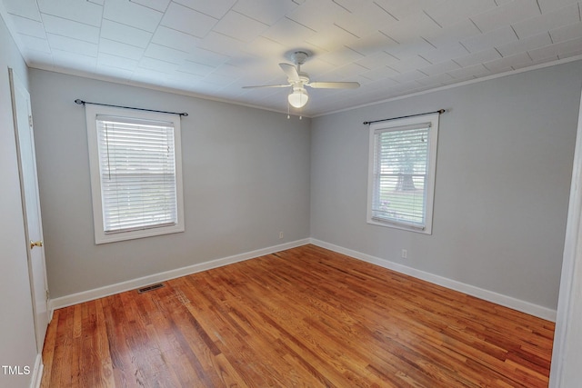 111 Dee Long Rd, Roxboro, NC 27574 - empty room with a ceiling fan, light wood-type flooring, ornamental molding, and baseboards